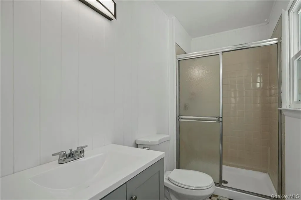 Full bathroom with vanity and a shower stall Full bathroom with vanity and a shower stall