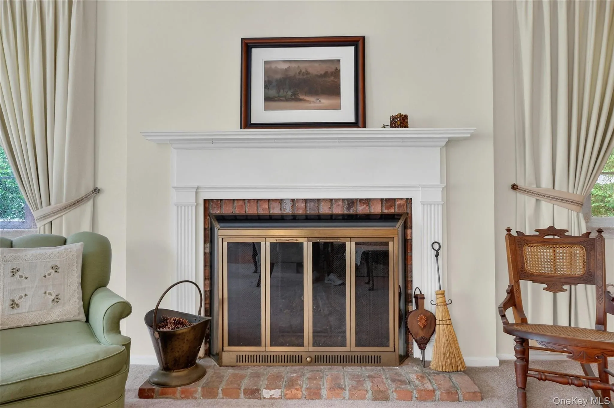 Living room fireplace, gather around the fireplace for the holidays. Gas (propane) fireplace featuring a brick surround and hearth, white mantel. Living room fireplace, gather around the fireplace for the holidays. Gas (propane) fireplace featuring a brick surround and hearth, white mantel.