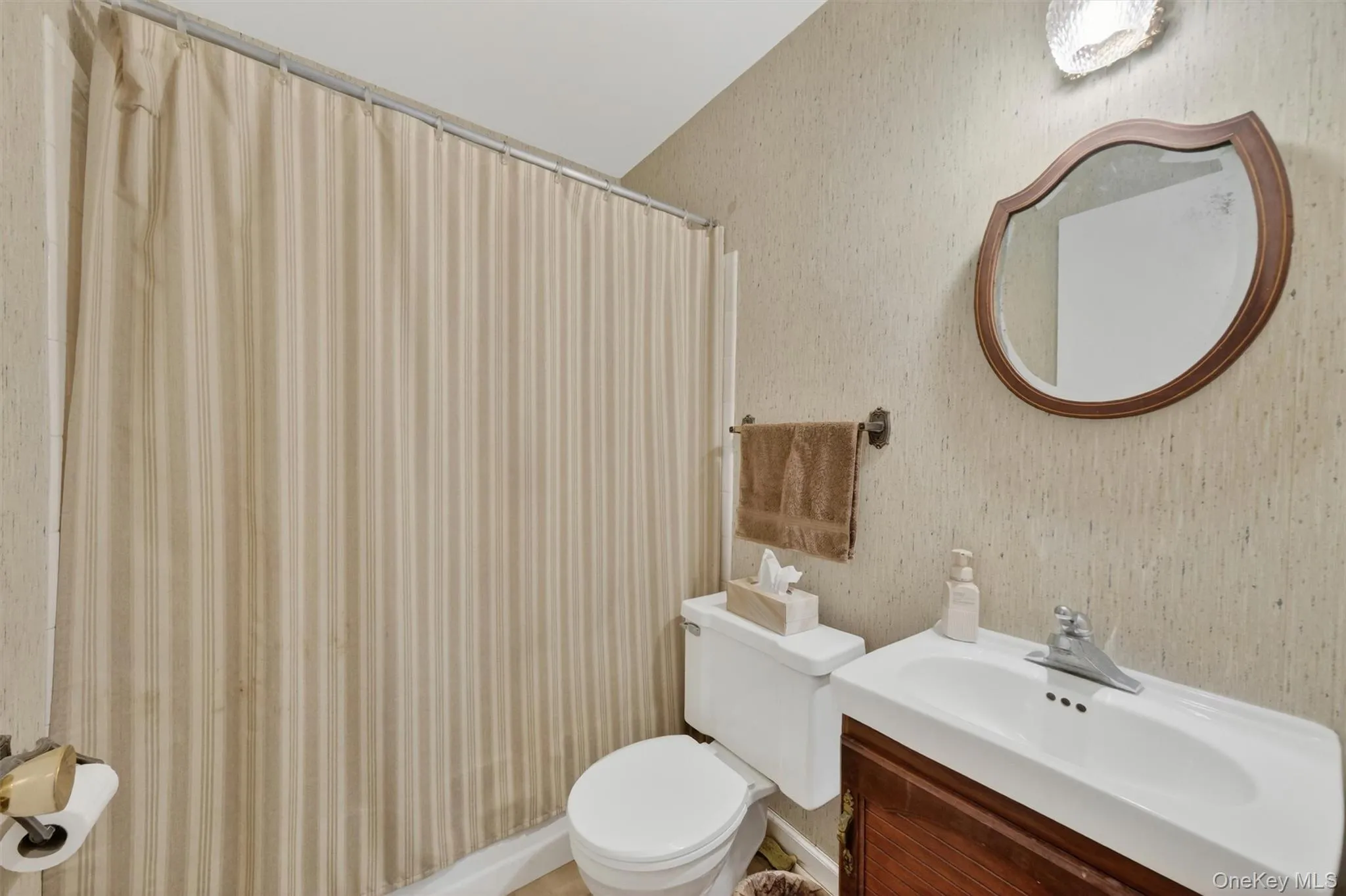 This main level bathroom is part of a first floor suite that can be used as a home office or possible additional bedroom space. This main level bathroom is part of a first floor suite that can be used as a home office or possible additional bedroom space.