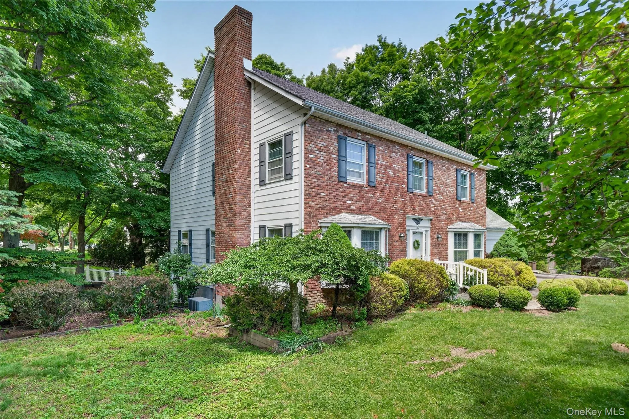 Landscaped lawns surround the home. Landscaped lawns surround the home.