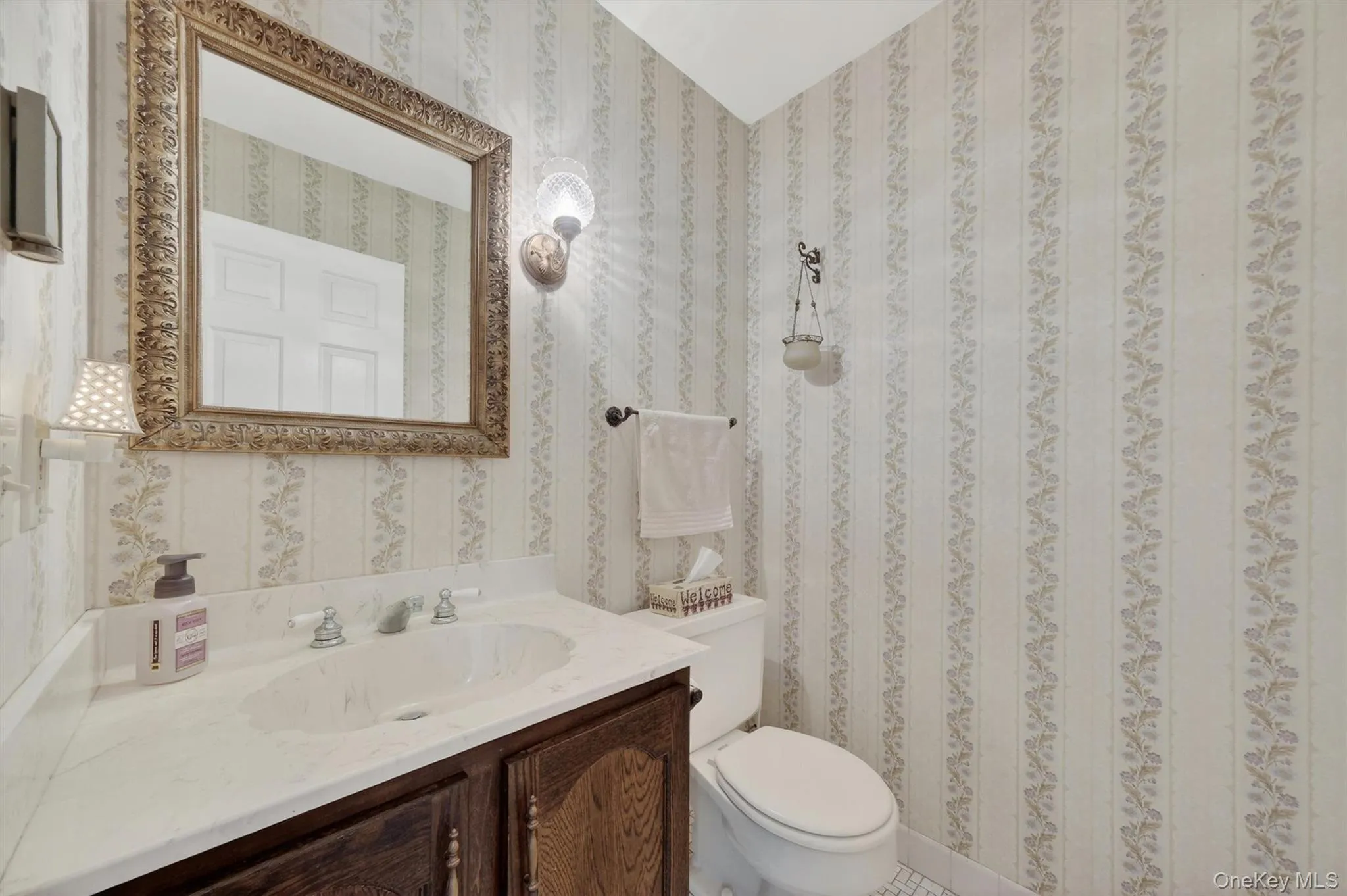 Poweder room / half bath off main level entry hall. Perfect for guests when entertaining. Poweder room / half bath off main level entry hall. Perfect for guests when entertaining.