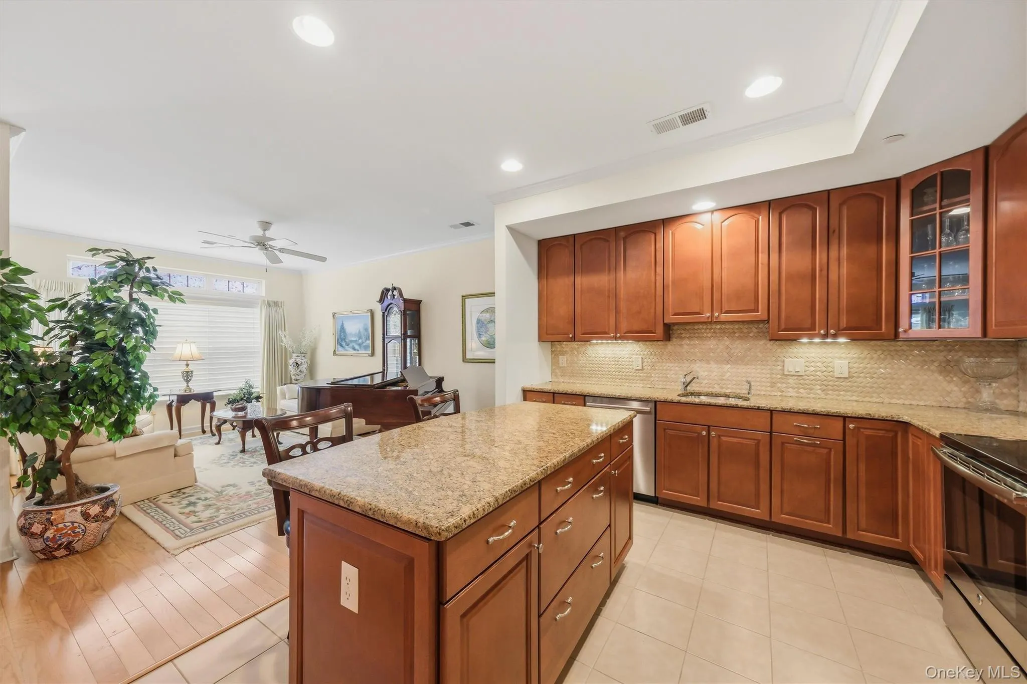 Thoughtfully designed kitchen offering abundant storage, including cabinetry in the island and a pantry cabinet beside the refrigerator. Thoughtfully designed kitchen offering abundant storage, including cabinetry in the island and a pantry cabinet beside the refrigerator.