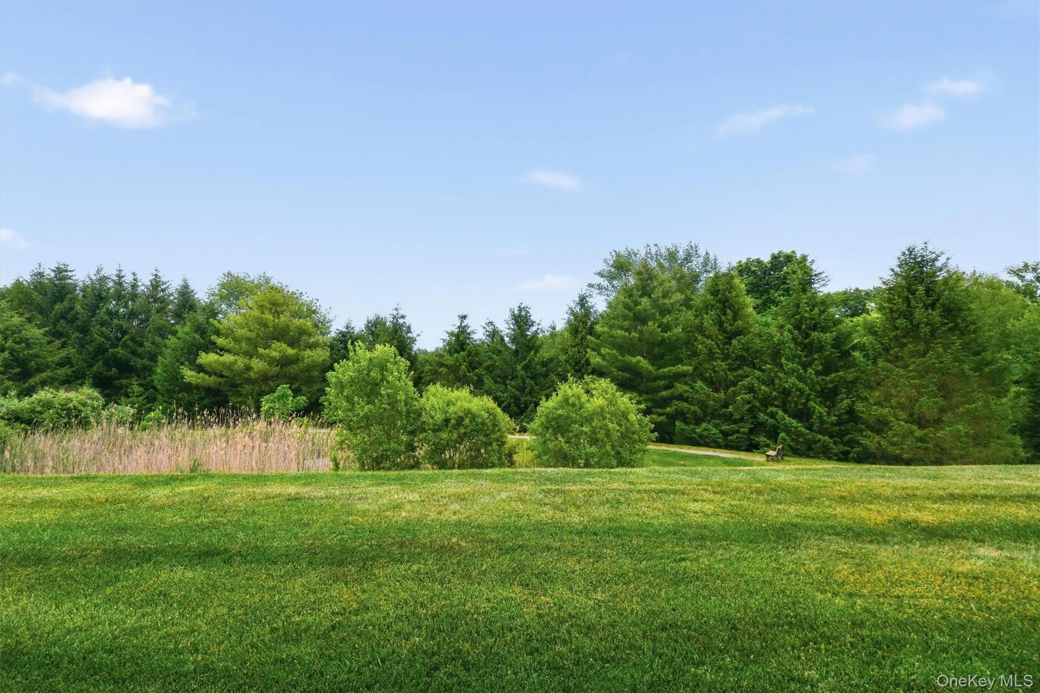 Back patio offers a quiet retreat with views of the walking trail and rolling landscape. Back patio offers a quiet retreat with views of the walking trail and rolling landscape.