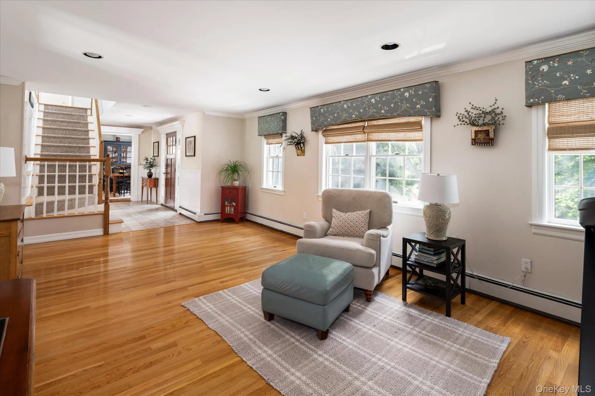 Living Room with Foyer and Stairs to Second Floor Living Room with Foyer and Stairs to Second Floor