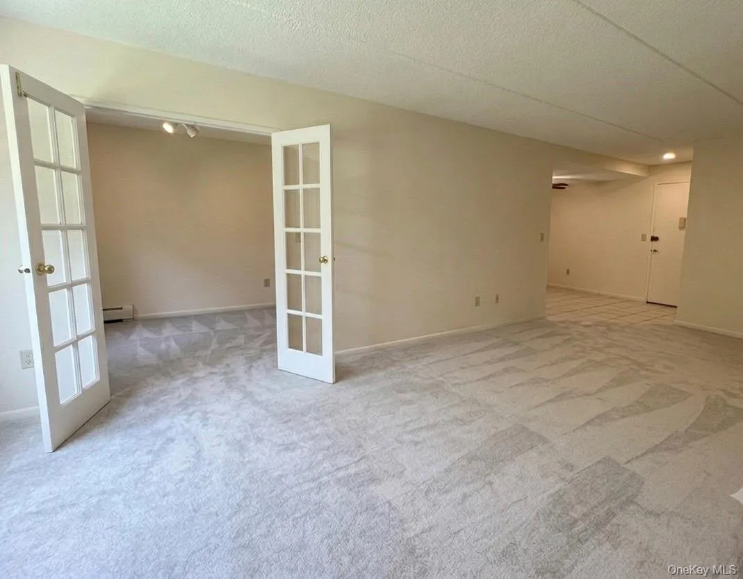 Living area, French door to the Den/2nd bedroom Living area, French door to the Den/2nd bedroom