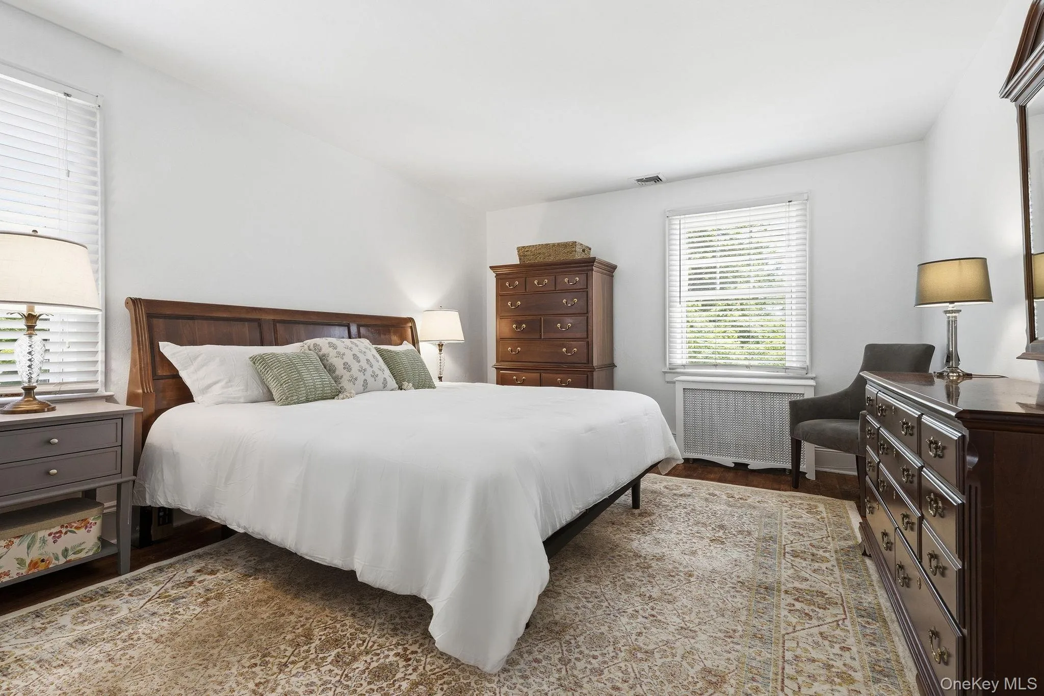 A spacious primary bedroom comfortably accommodates a king-size bed while maintaining a warm and restful feel. A spacious primary bedroom comfortably accommodates a king-size bed while maintaining a warm and restful feel.
