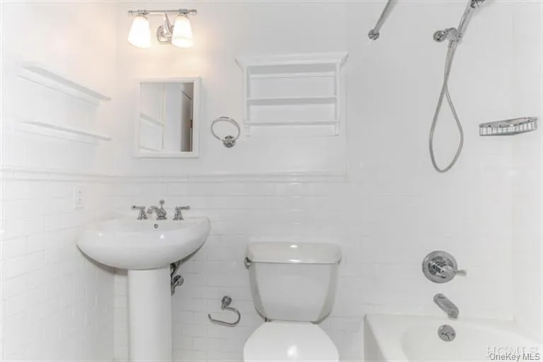 Ensuite bath to master bedroom: Tub with shower Ensuite bath to master bedroom: Tub with shower