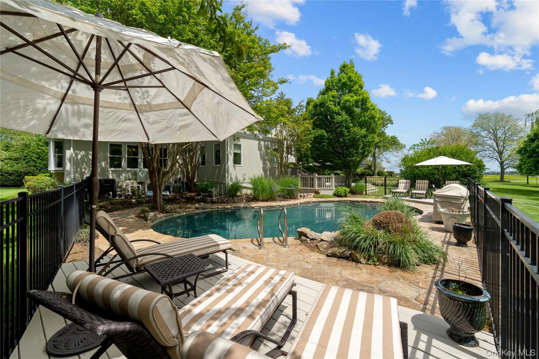 CUSTOM IN GROUND GUNITE HEATED SALTWATER POOL CUSTOM IN GROUND GUNITE HEATED SALTWATER POOL