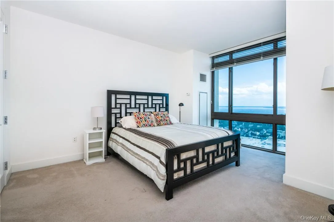 Main bedroom with floor to ceiling windows Main bedroom with floor to ceiling windows