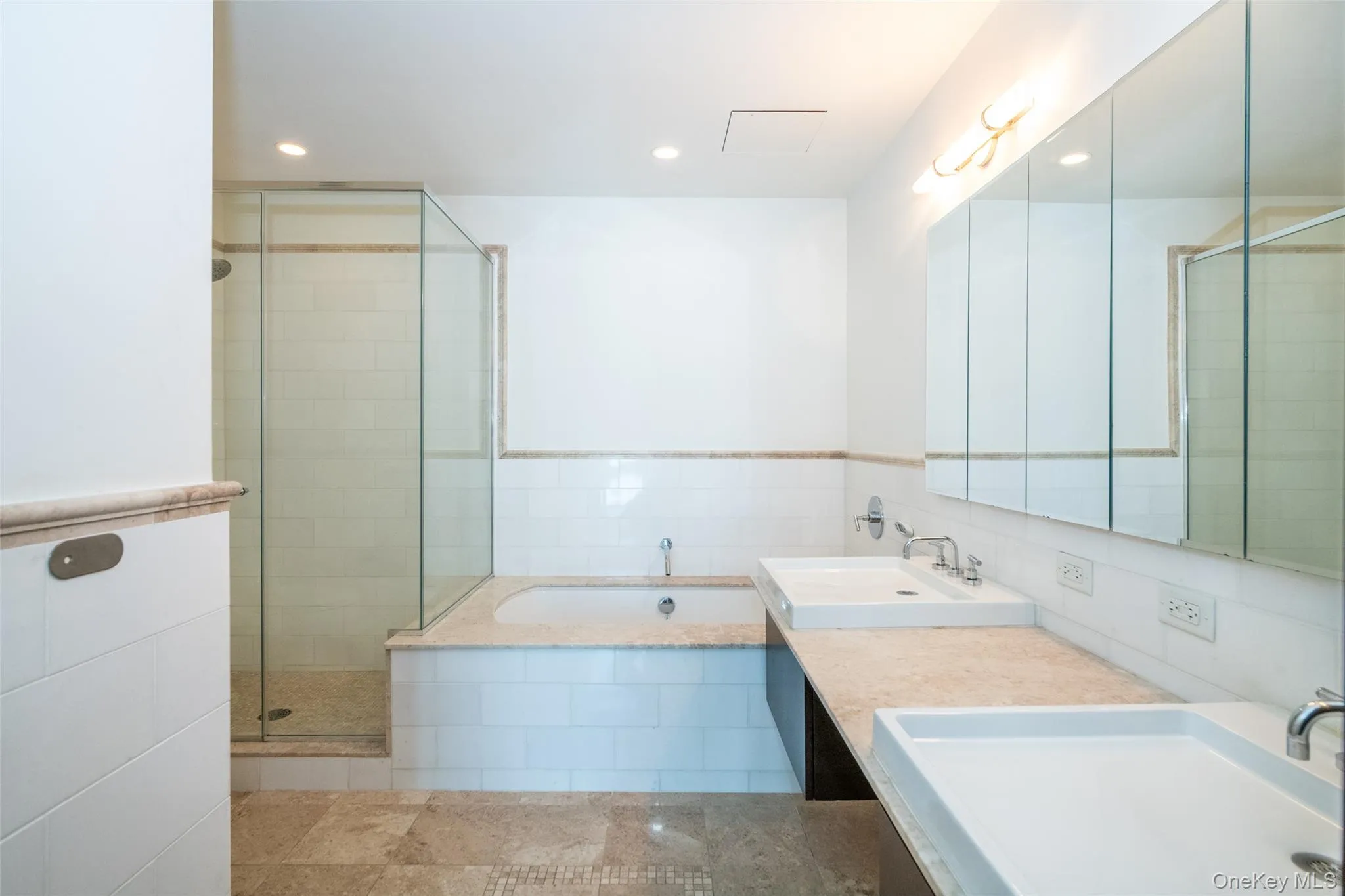 Full bathroom featuring a bath, a stall shower, double vanity, and recessed lighting Full bathroom featuring a bath, a stall shower, double vanity, and recessed lighting