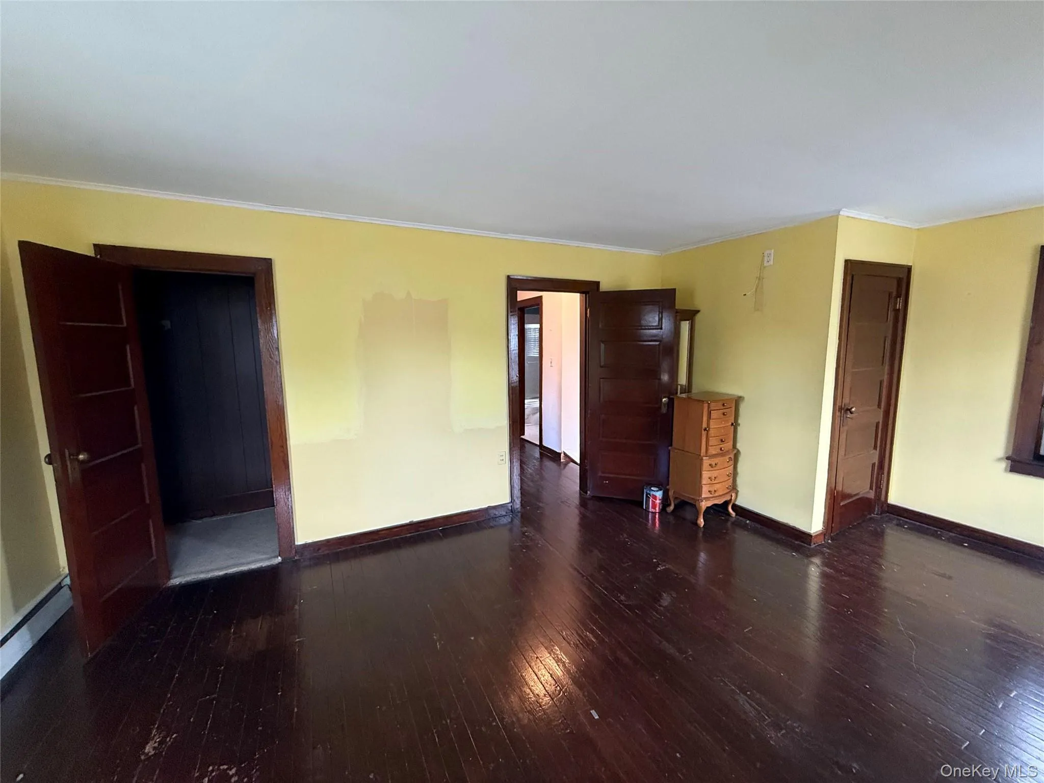 Spacious bedroom with multiple windows and generous living space. Spacious bedroom with multiple windows and generous living space.