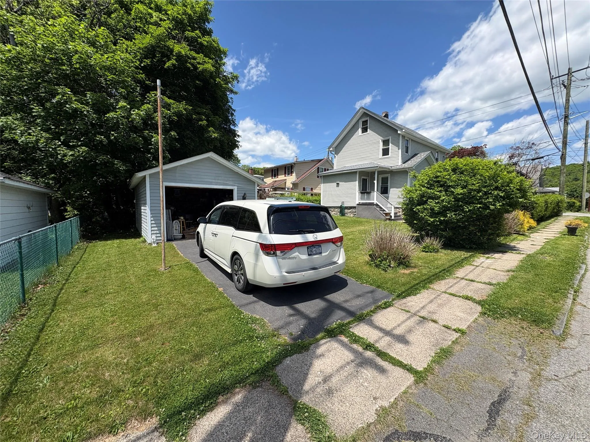 Detached garage.Private driveway providing ample off-street parking. Detached garage.Private driveway providing ample off-street parking.