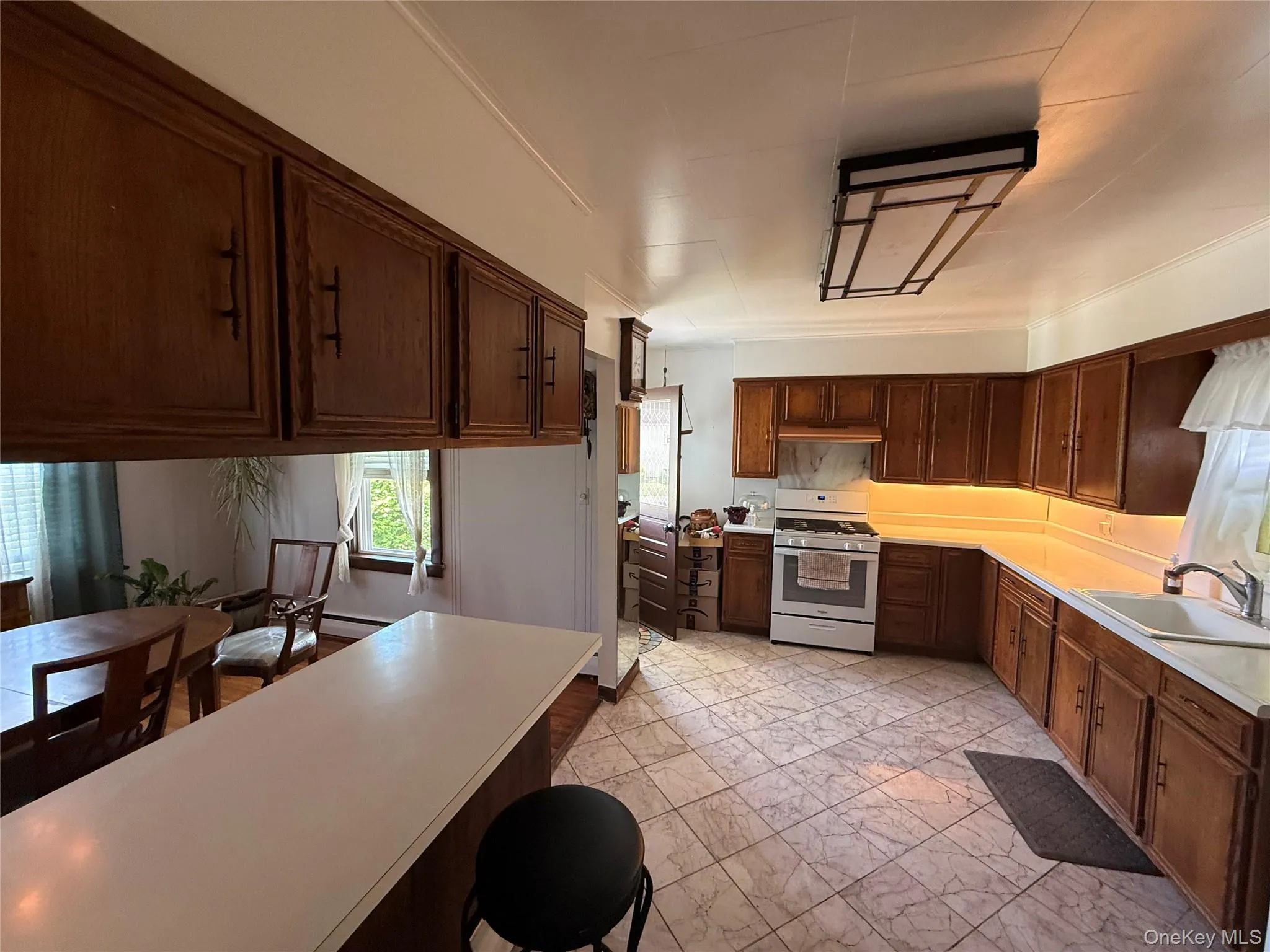 Spacious kitchen with ample cabinet and counter space. Spacious kitchen with ample cabinet and counter space.