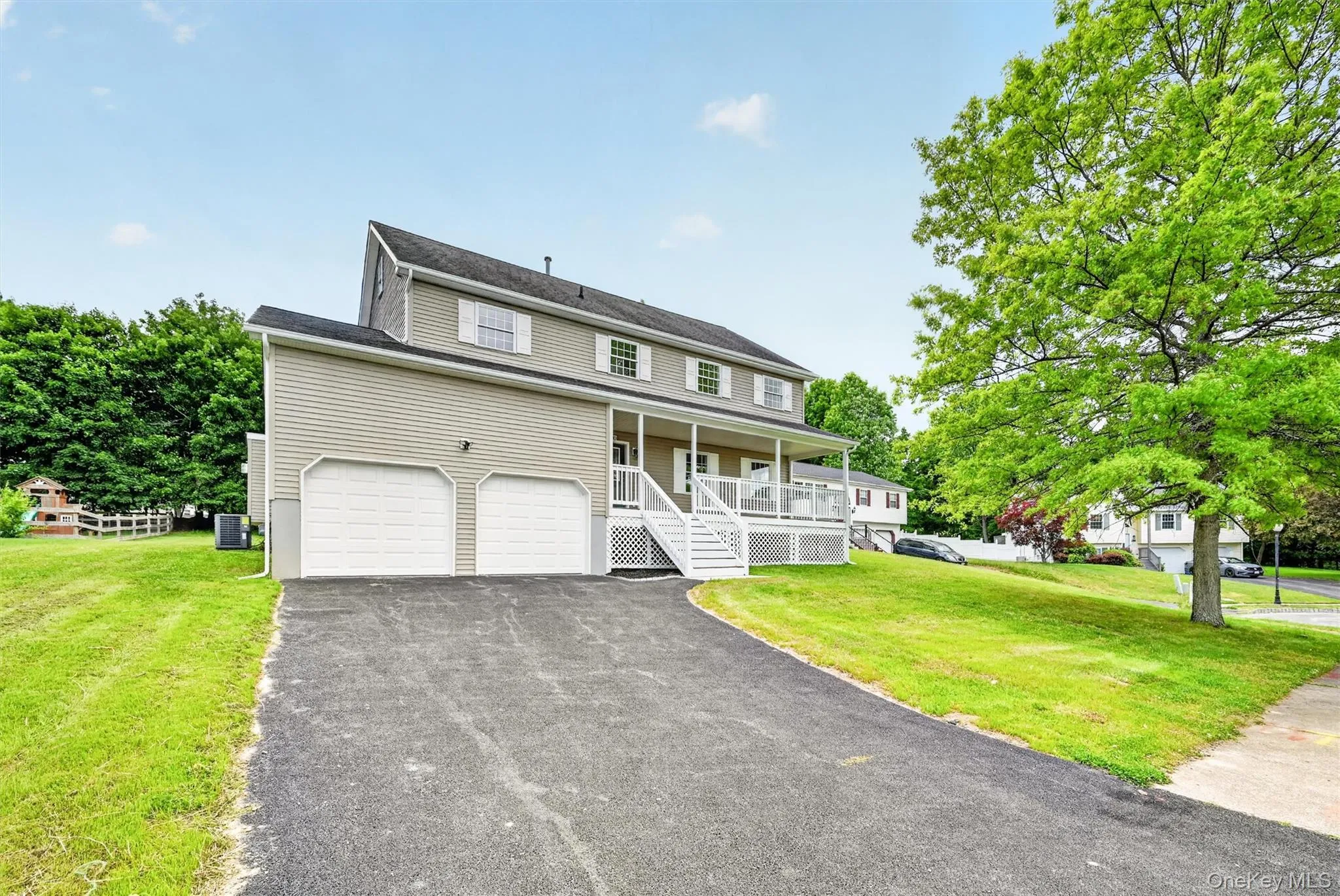 Exterior facade featuring light gray siding and white trim Exterior facade featuring light gray siding and white trim