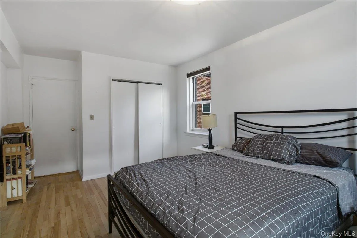 Bedroom entry, double closet and window Bedroom entry, double closet and window