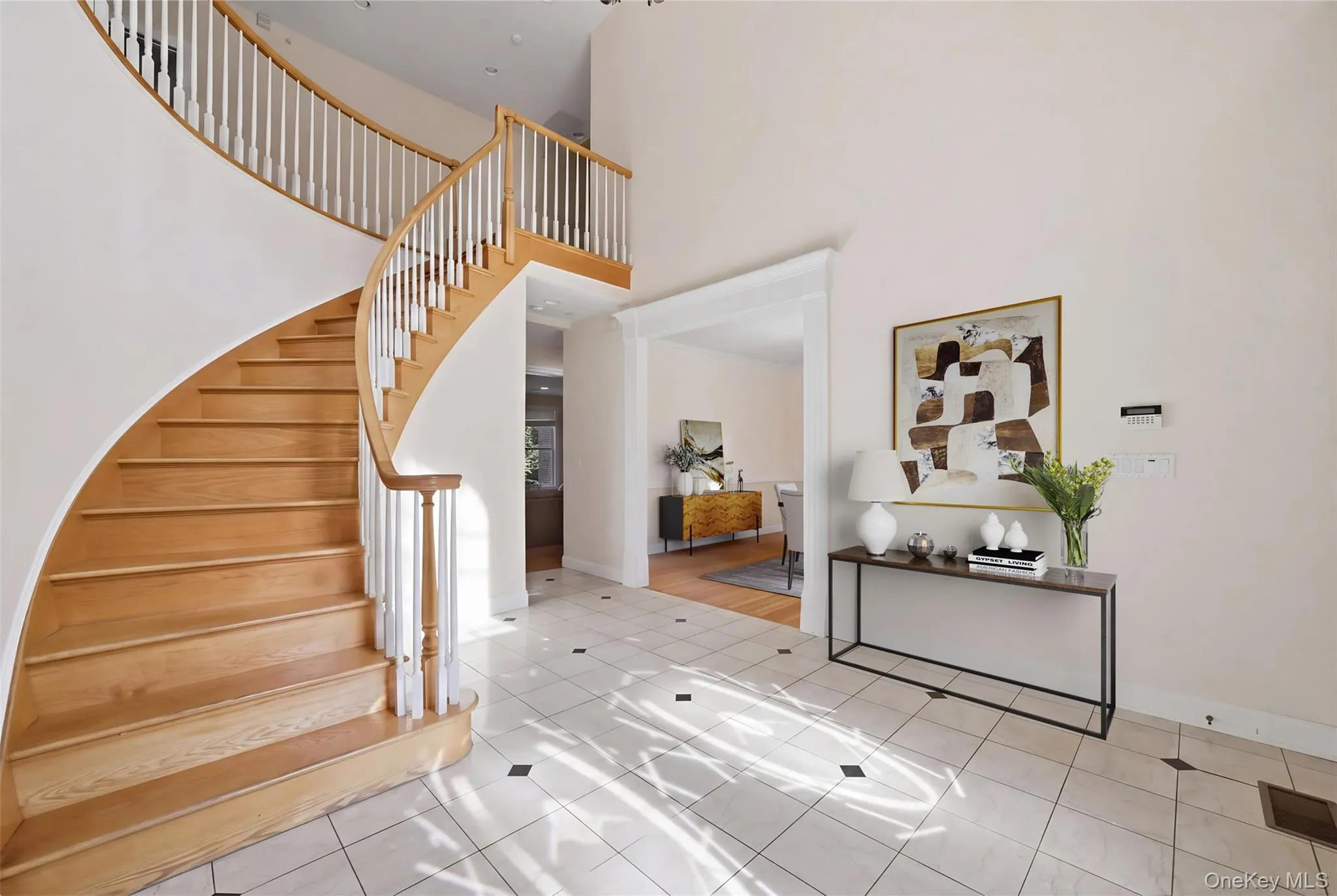 Grand sweeping staircase—virtually staged Grand sweeping staircase—virtually staged