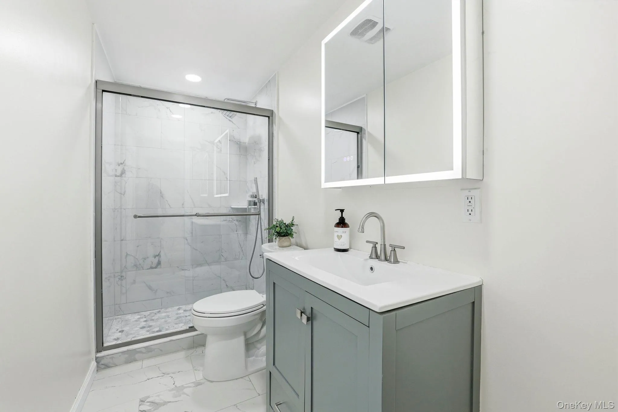 Lower-level bathroom with walk-in shower Lower-level bathroom with walk-in shower
