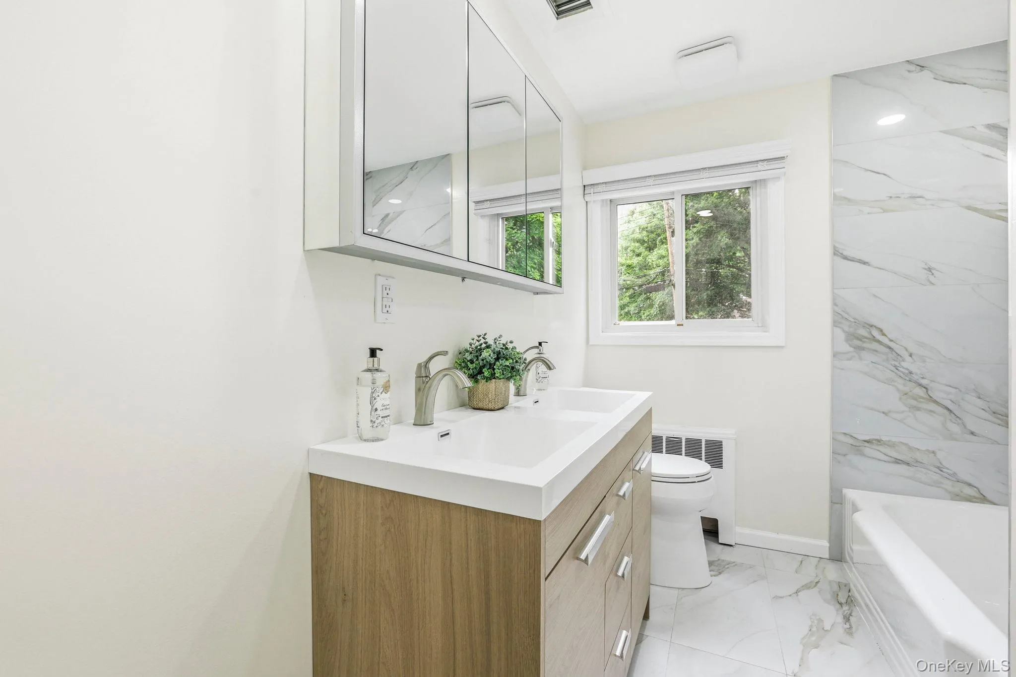 Hallway bathroom with tub/shower combination on the second level Hallway bathroom with tub/shower combination on the second level