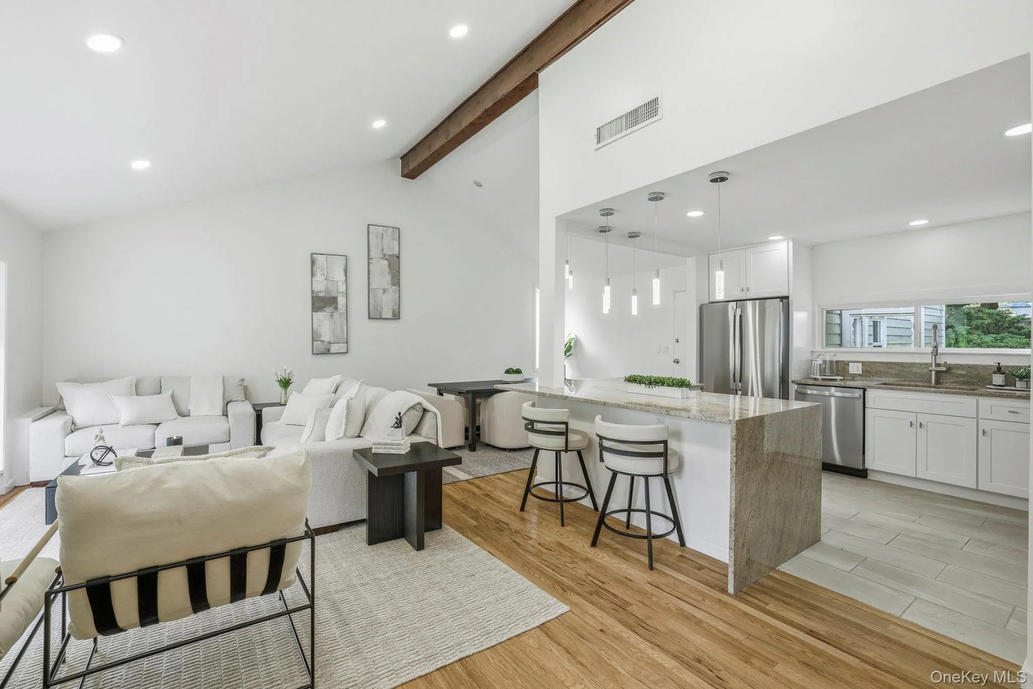 Open-concept first floor with a grand vaulted ceiling Open-concept first floor with a grand vaulted ceiling