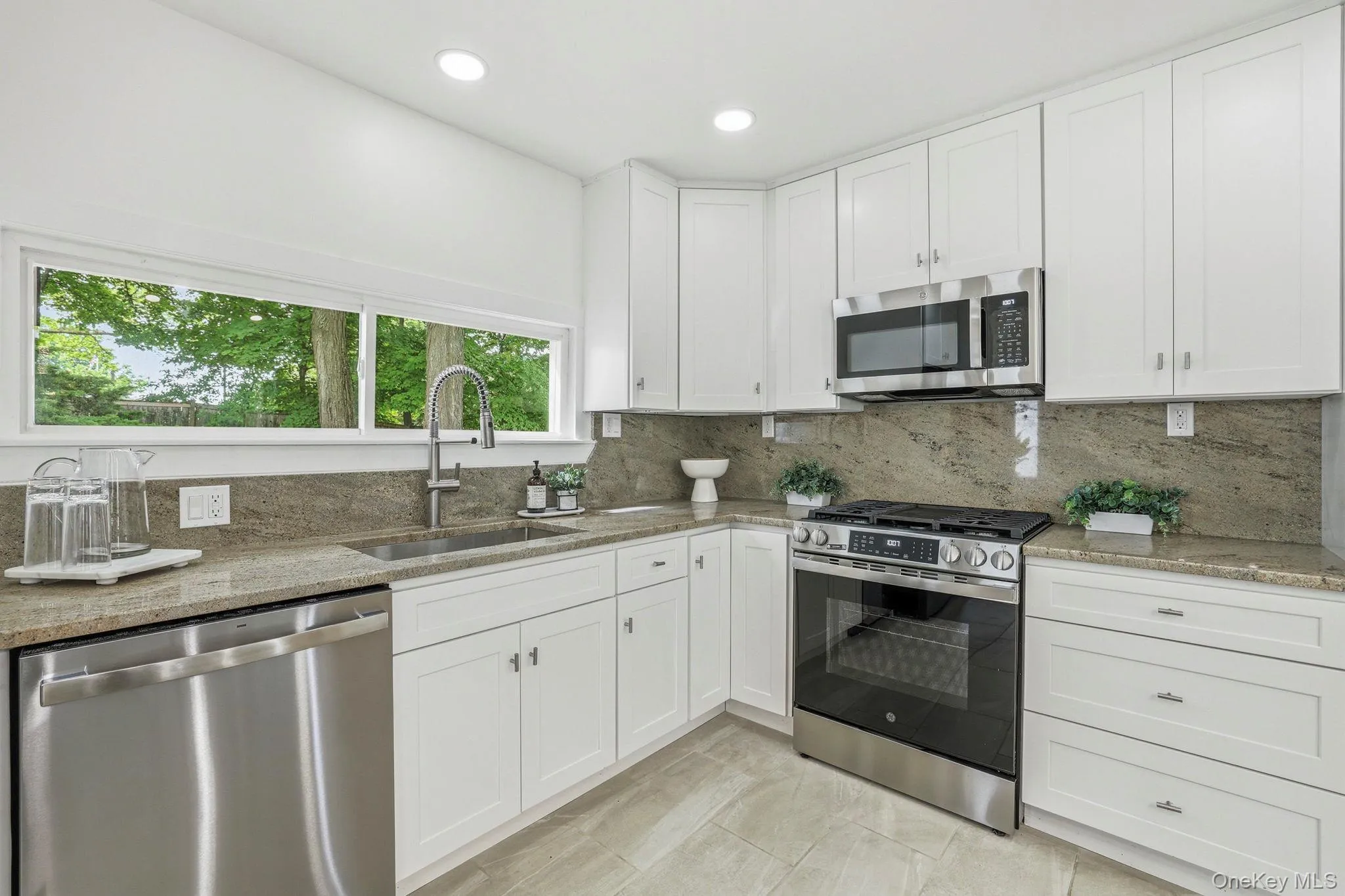 Renovated kitchen with stainless steel appliances and granite counter and backsplash - be the first to use them! Renovated kitchen with stainless steel appliances and granite counter and backsplash - be the first to use them!