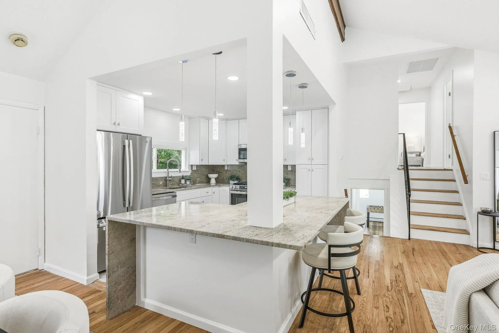 Beautiful Kitchen with views of the stairs to the second floor and lower-level Beautiful Kitchen with views of the stairs to the second floor and lower-level