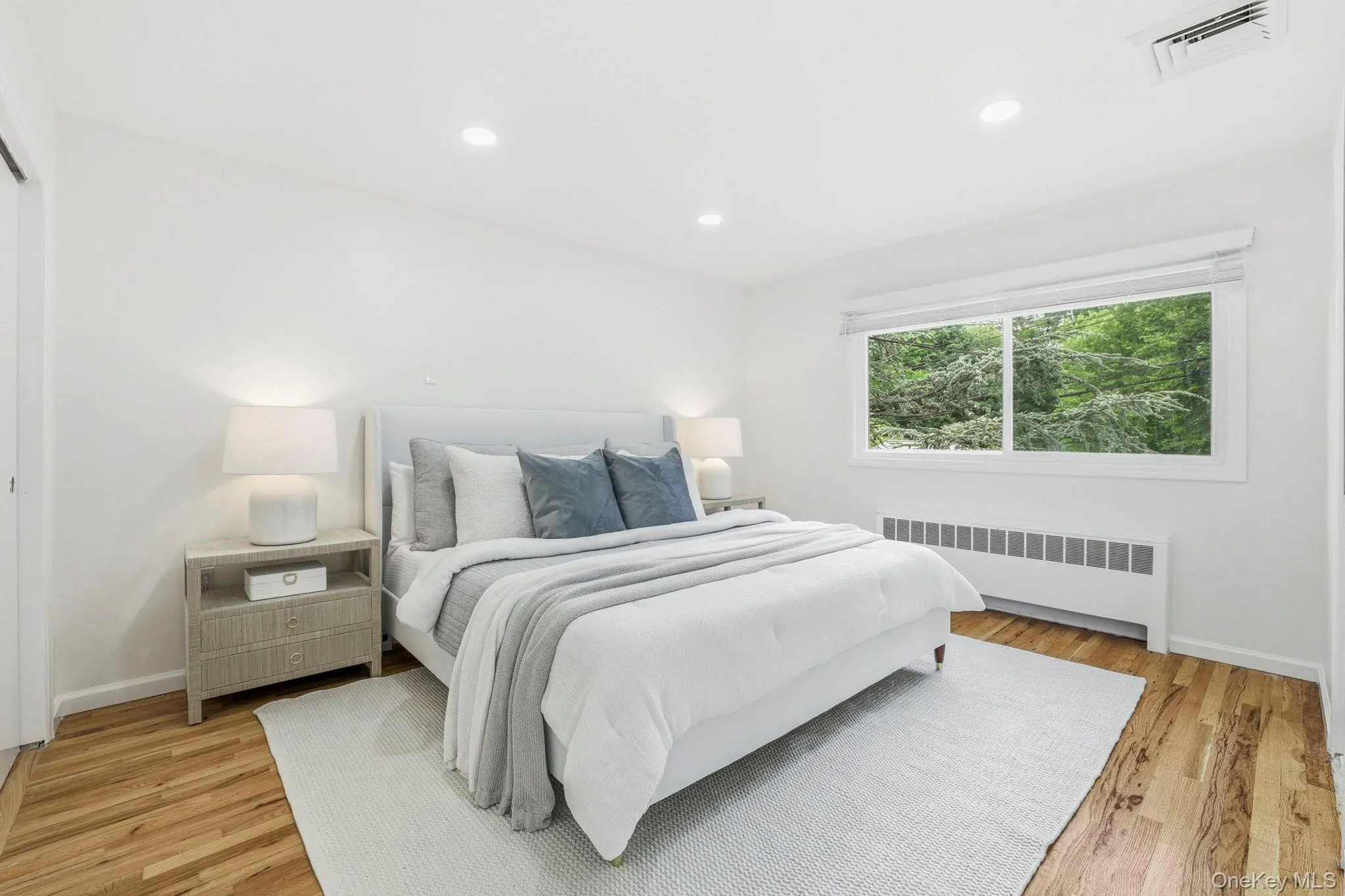 Spacious Primary bedroom with large new window on the second level Spacious Primary bedroom with large new window on the second level