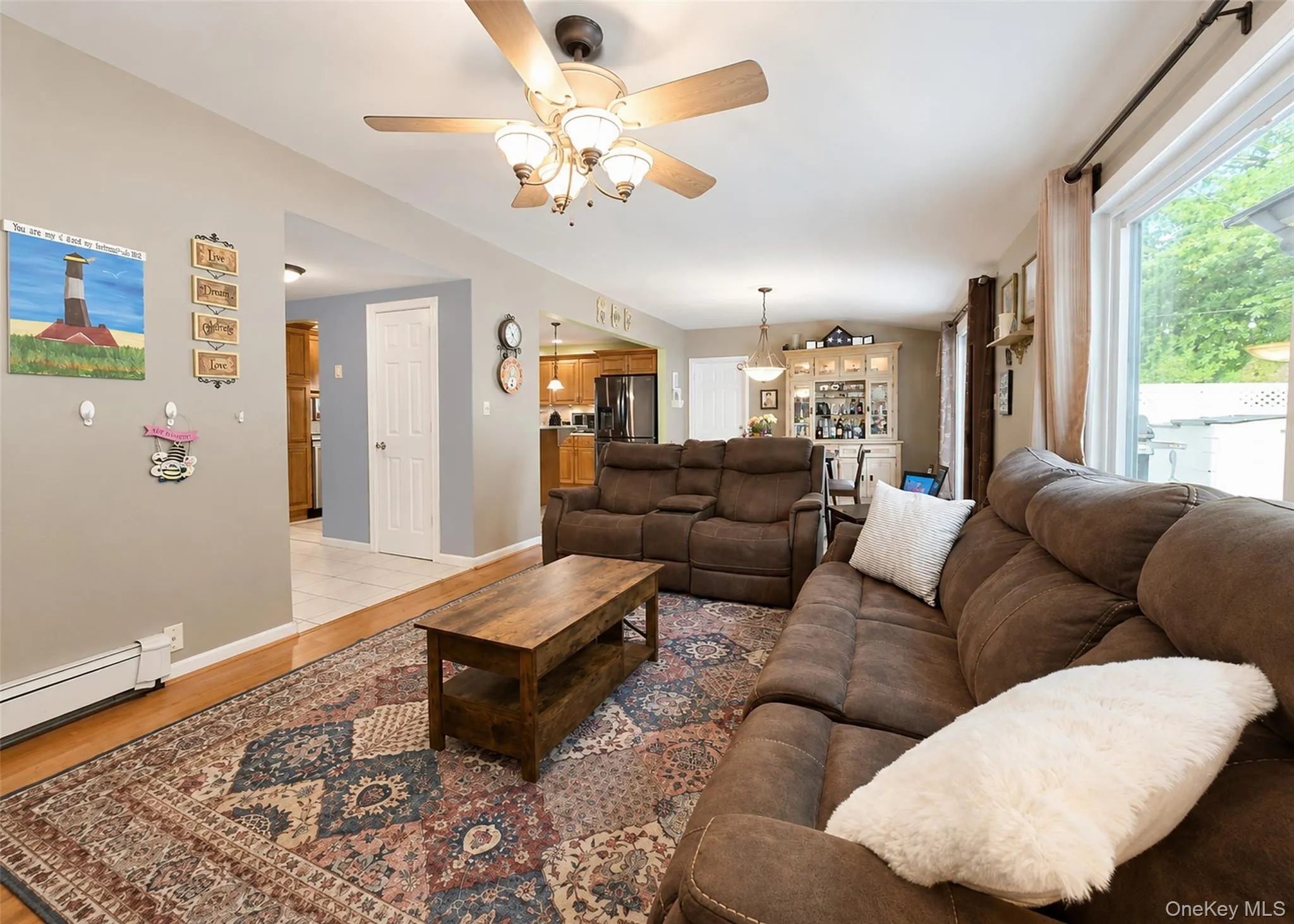 Living area with LVP flooring and a ceiling fan Living area with LVP flooring and a ceiling fan