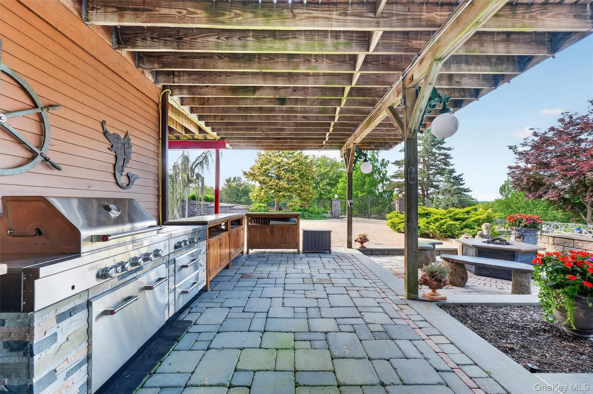 Hosting a pool party is a breeze with the expansive outdoor cookout space Hosting a pool party is a breeze with the expansive outdoor cookout space