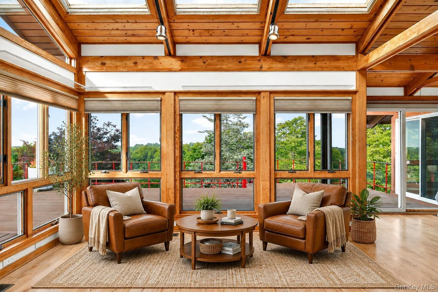 Surrounded by windows and wood, the living room has almost treehouse vibes*virtually staged* Surrounded by windows and wood, the living room has almost treehouse vibes*virtually staged*