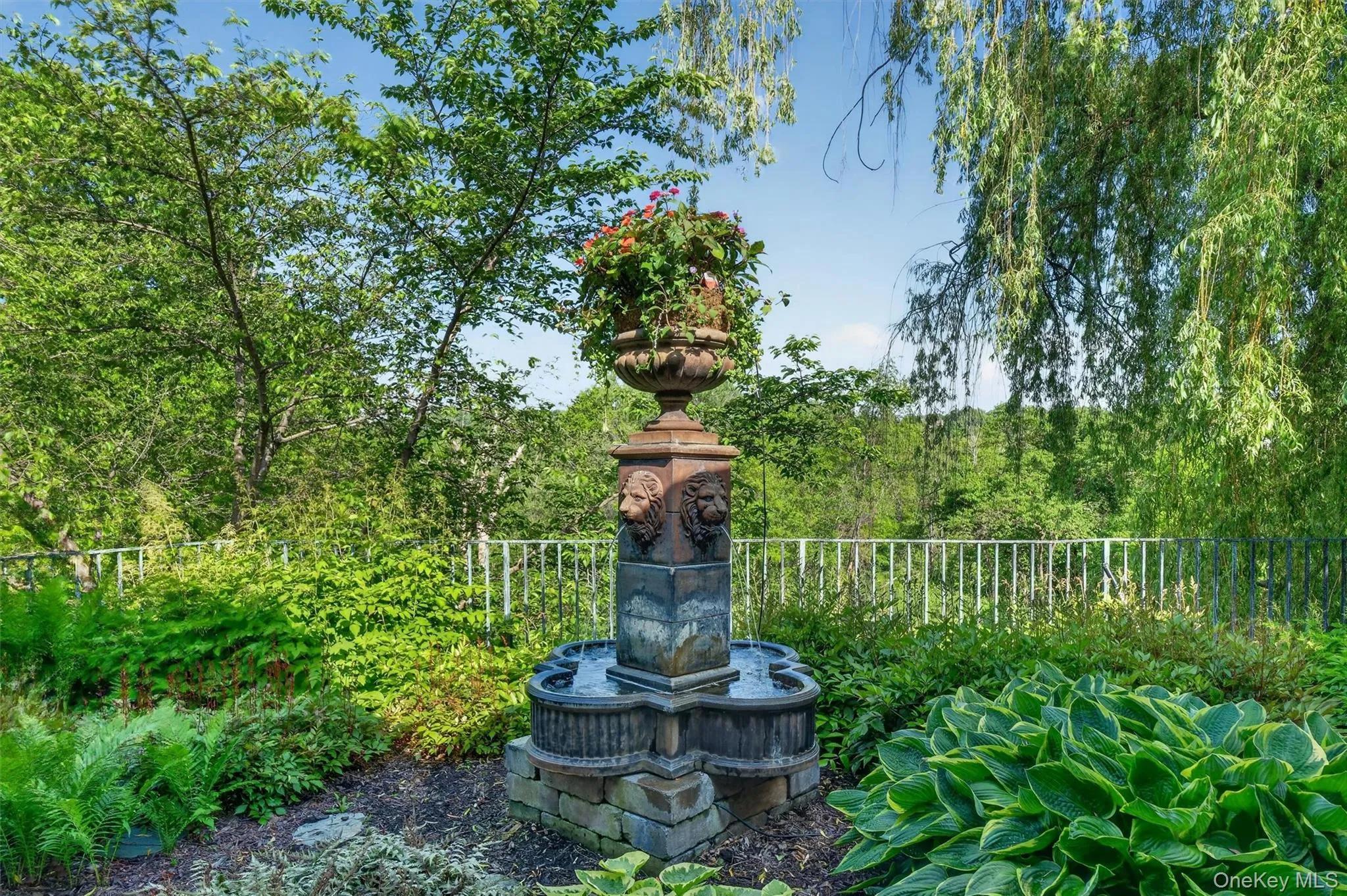Mature gardens graced with statues, urns and water features are displayed throughout the property. All urns and planters have automatic drip watering systems. Mature gardens graced with statues, urns and water features are displayed throughout the property. All urns and planters have automatic drip watering systems.