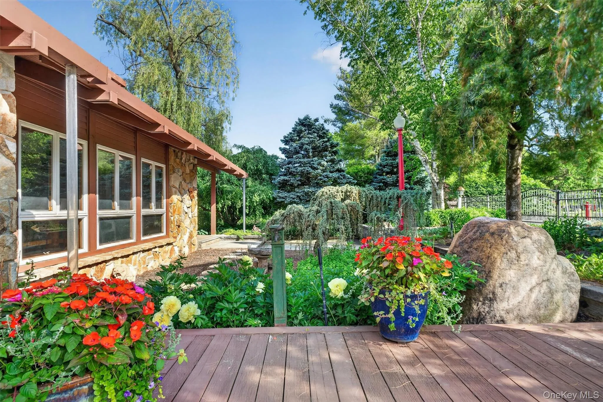 Extensive decks and mature perennial gardens surround the main house Extensive decks and mature perennial gardens surround the main house