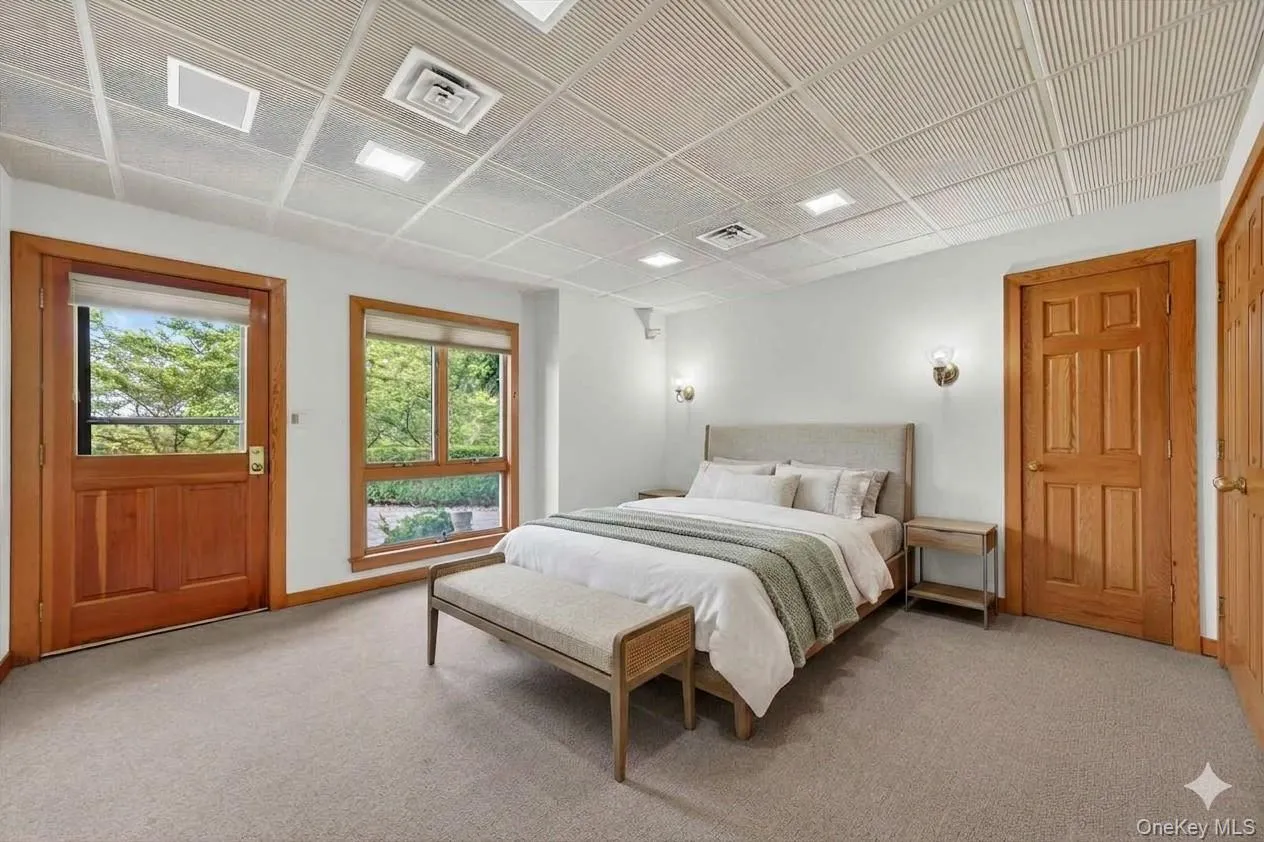 Direct access to the hot tub and pool deck from the lower level bedroom Direct access to the hot tub and pool deck from the lower level bedroom
