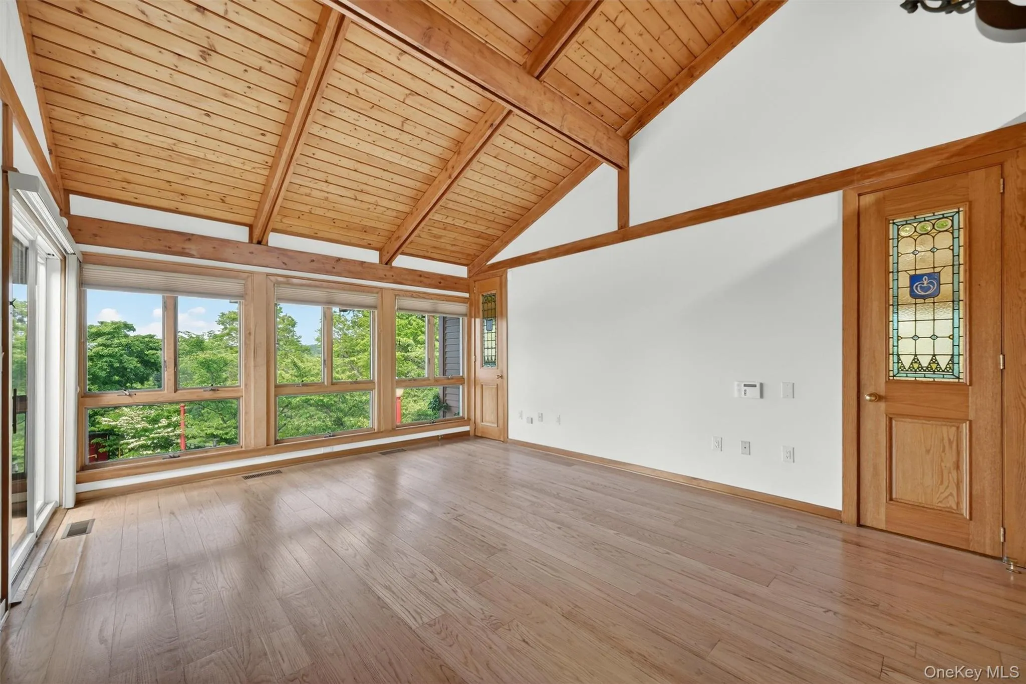 The primary suite is light and bright with walls of windows and a fabulous view of the pool deck, farm and beyond The primary suite is light and bright with walls of windows and a fabulous view of the pool deck, farm and beyond