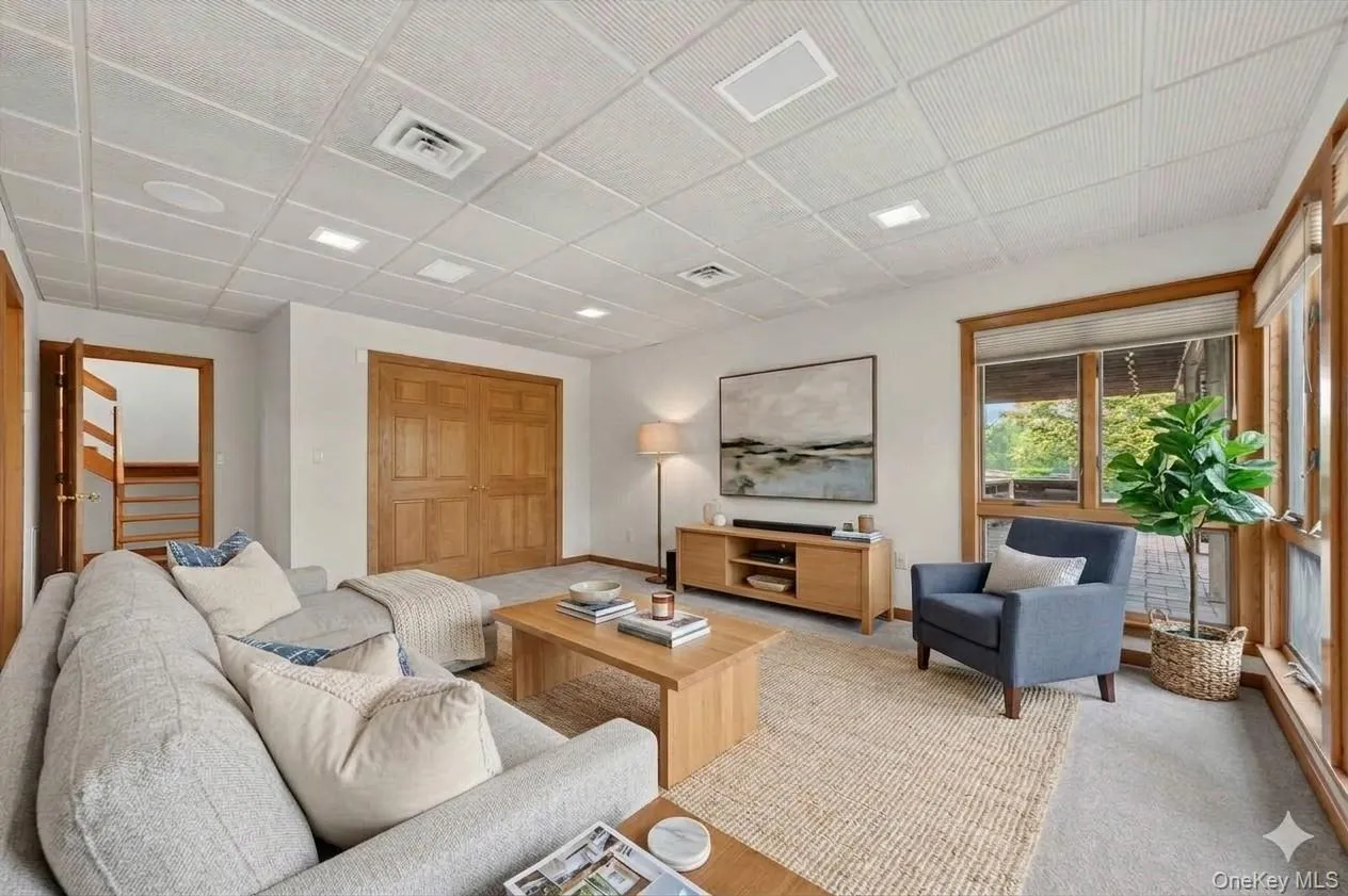 Lower level bedroom staged as a living area*virtually staged* Lower level bedroom staged as a living area*virtually staged*