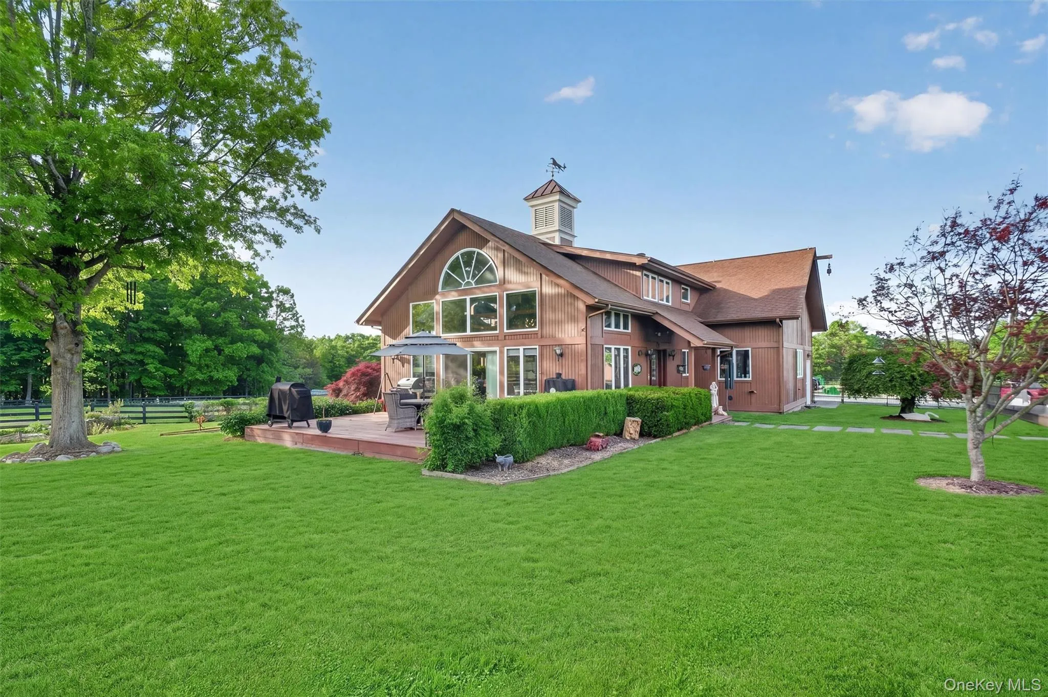 2nd home features a wall of windows to take in the views, a low deck for outdoor entertainment and an expansive lawn with koi pond 2nd home features a wall of windows to take in the views, a low deck for outdoor entertainment and an expansive lawn with koi pond