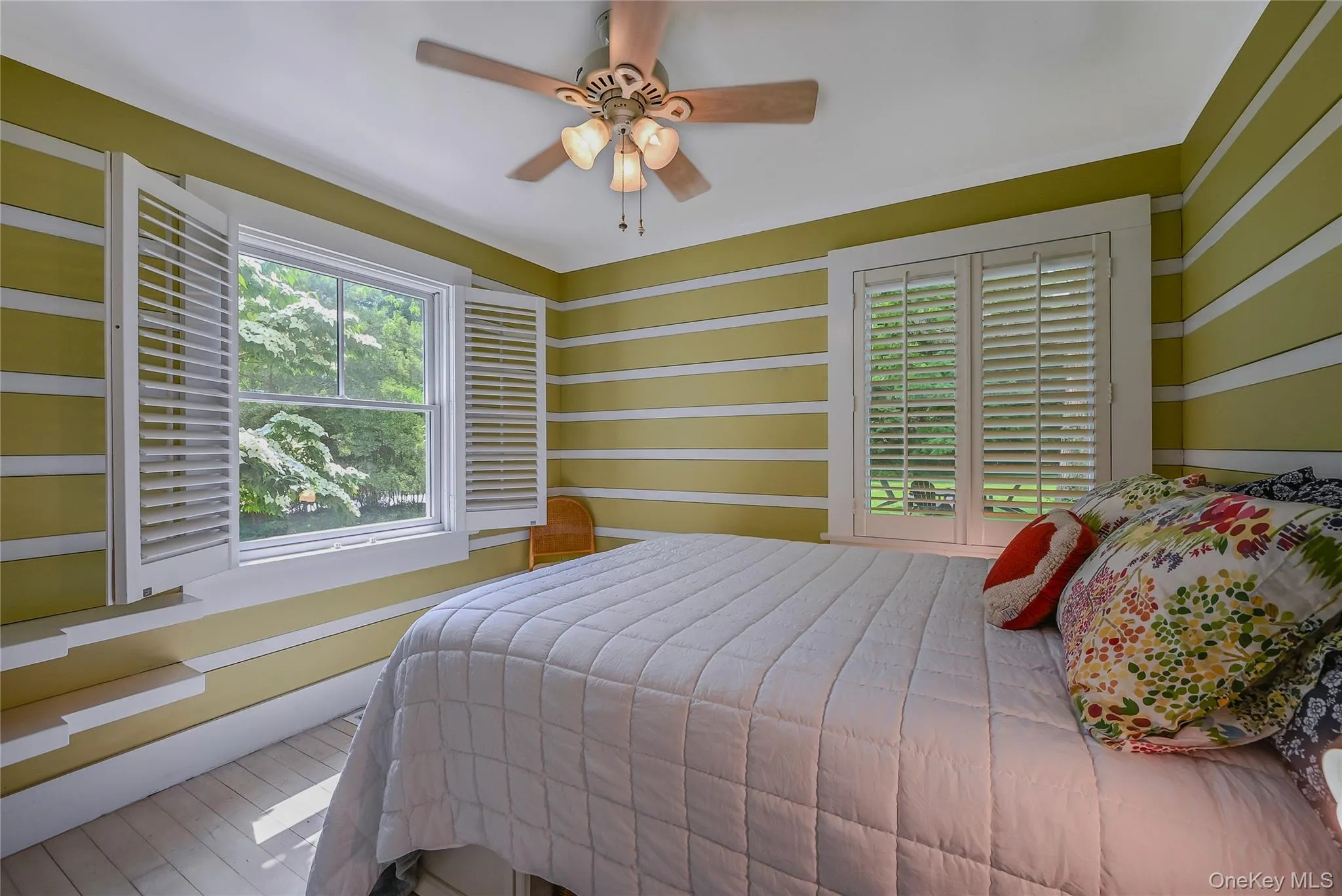 Bedroom featuring a ceiling fan Bedroom featuring a ceiling fan