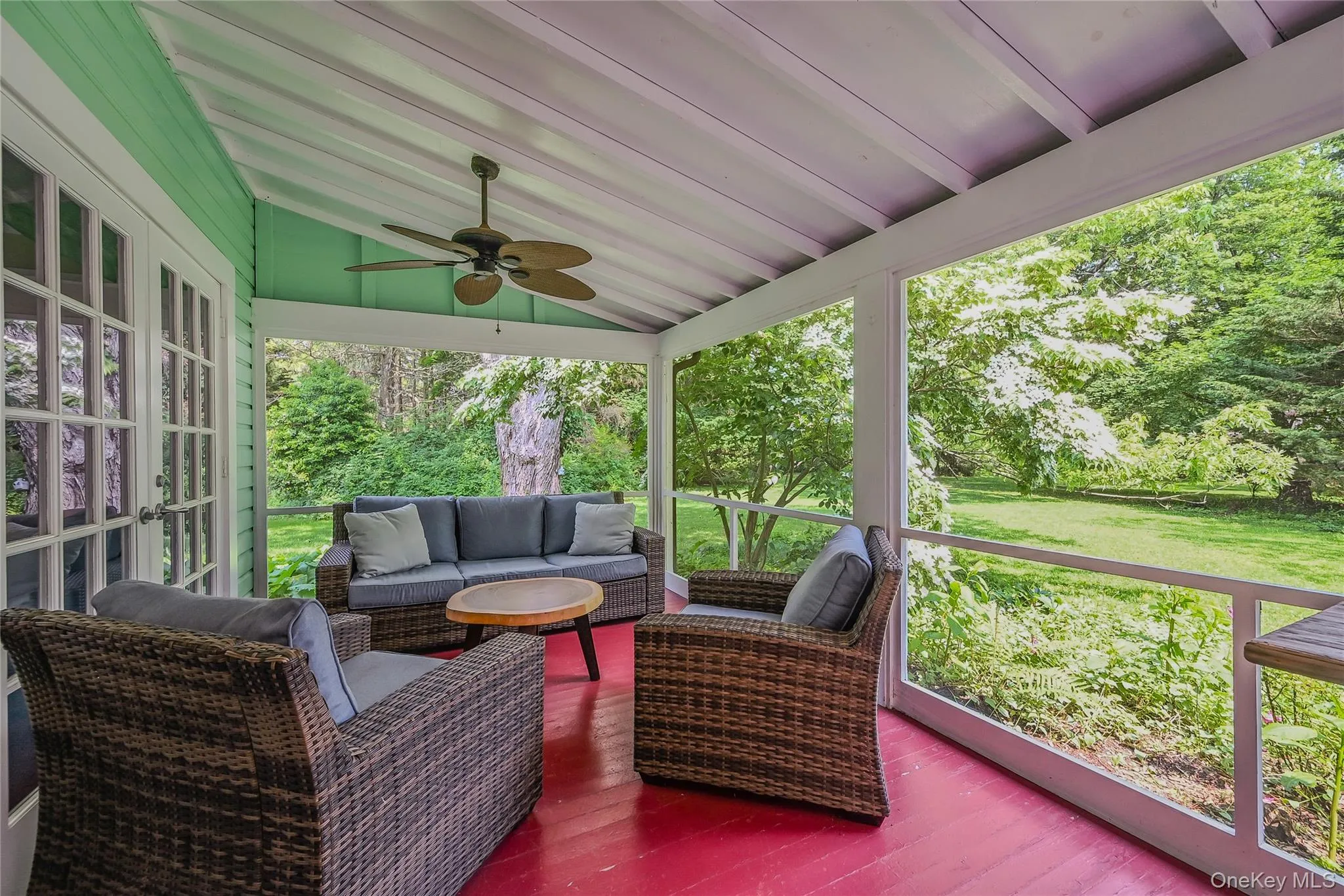Deck featuring a ceiling fan, an outdoor hangout area, french doors, and a lawn Deck featuring a ceiling fan, an outdoor hangout area, french doors, and a lawn