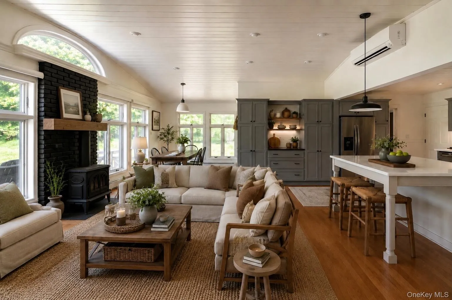 Virtually staged family room, breakfast bar, and dining area Virtually staged family room, breakfast bar, and dining area