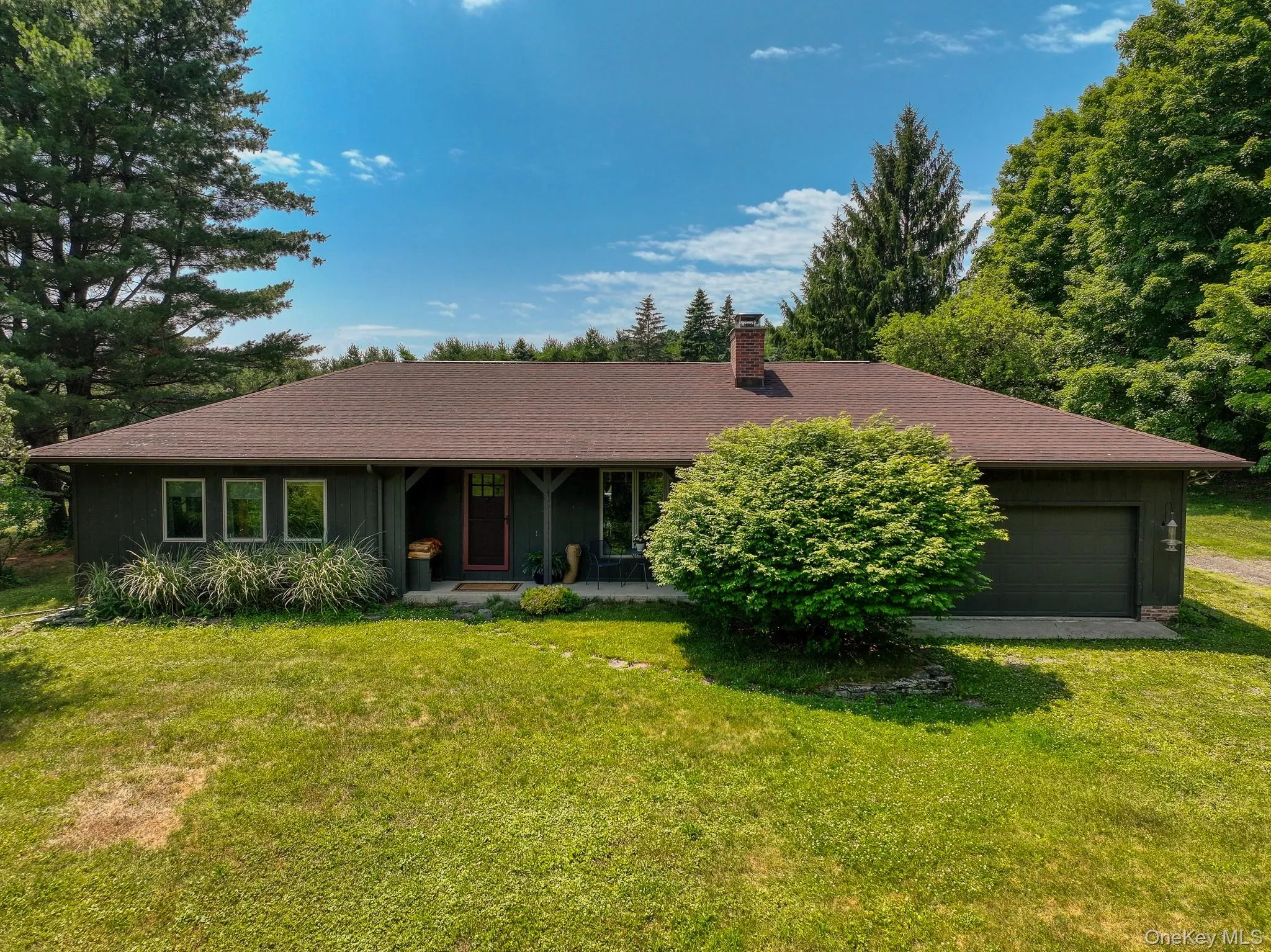 The elevated setting of this Ranch style home provides a lovely mountain view from the front porch The elevated setting of this Ranch style home provides a lovely mountain view from the front porch