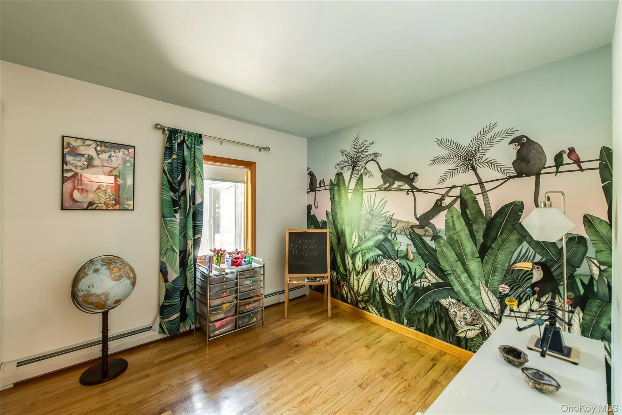 Bedroom 1 with Hygge & West mural, hardwood floors Bedroom 1 with Hygge & West mural, hardwood floors