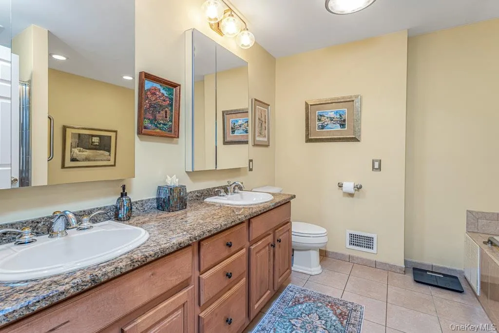 The primary bathroom, as you can plainly see, has double sinks loads of cabinetry and tile flooring. The primary bathroom, as you can plainly see, has double sinks loads of cabinetry and tile flooring.