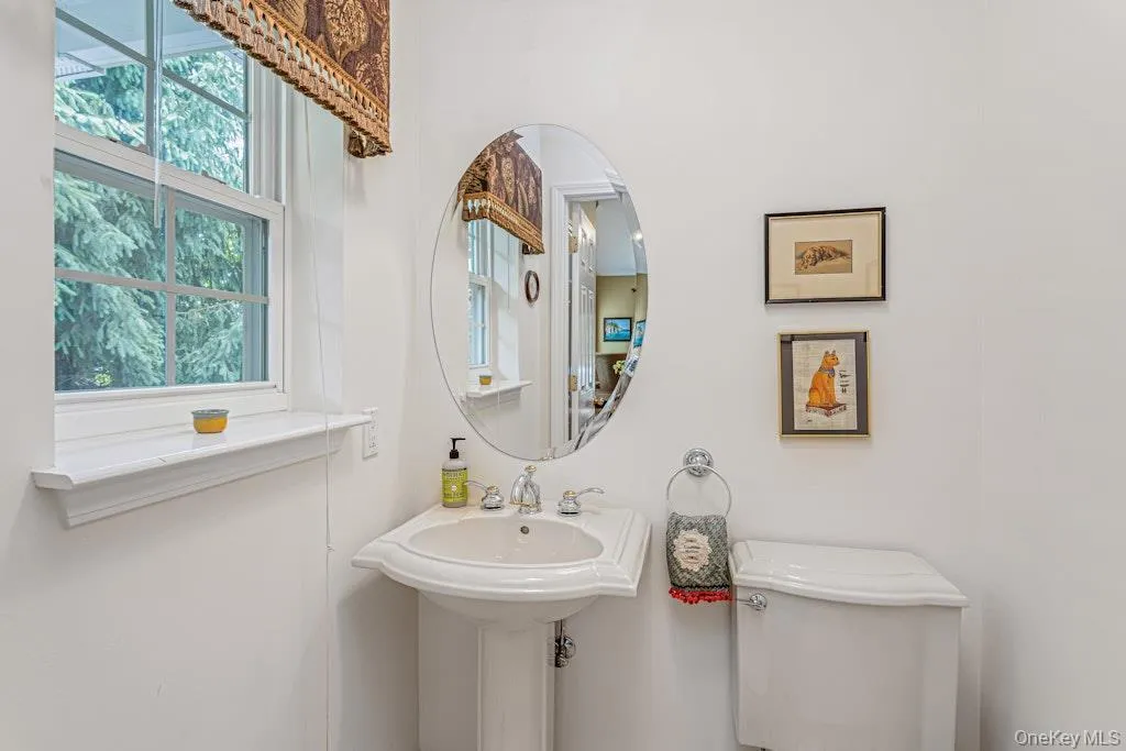 No first floor in a townhouse is ever complete without a powder room and here it is, just as impeccable as the rest of the home. No first floor in a townhouse is ever complete without a powder room and here it is, just as impeccable as the rest of the home.