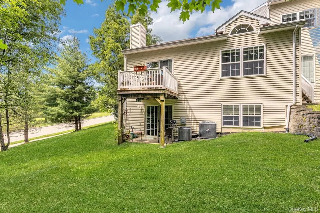 The back of the home is surrounded by a lush lawn and mature ptrees. The back of the home is surrounded by a lush lawn and mature ptrees.