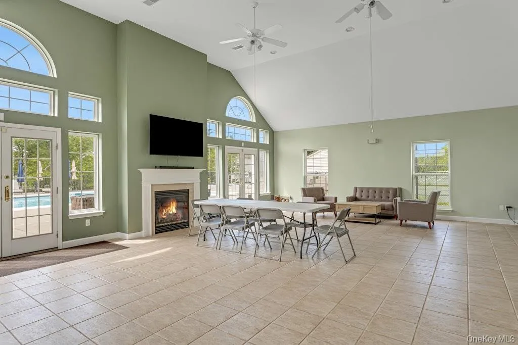 The main room of the clubhouse which is graced with a fireplace, is a bright, enormous space for, community meetings, parties, etc. and can be rented for your own private functions. A fireplace graces the room and there's also a gym, changing rooms, restrooms, and a kitchen. The main room of the clubhouse which is graced with a fireplace, is a bright, enormous space for, community meetings, parties, etc. and can be rented for your own private functions. A fireplace graces the room and there's also a gym, changing rooms, restrooms, and a kitchen.