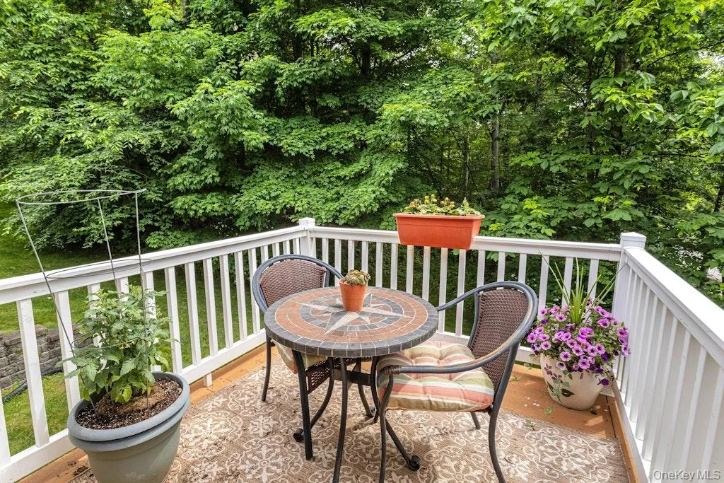 Back in the living room we head through the sliding glass door to the deck overlooking the grounds.....a delightful spot for summertime dining al fresco. Back in the living room we head through the sliding glass door to the deck overlooking the grounds.....a delightful spot for summertime dining al fresco.