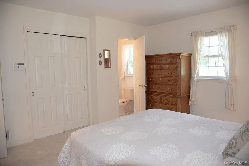Primary Bedroom with private half bath Primary Bedroom with private half bath