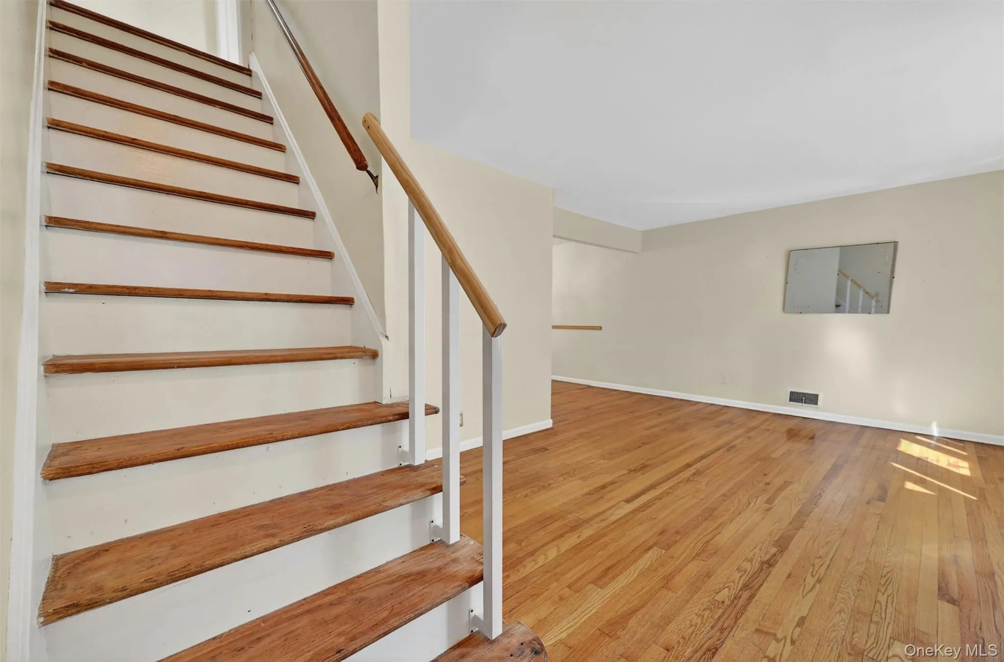 Staircase with wood treads and white risers Staircase with wood treads and white risers