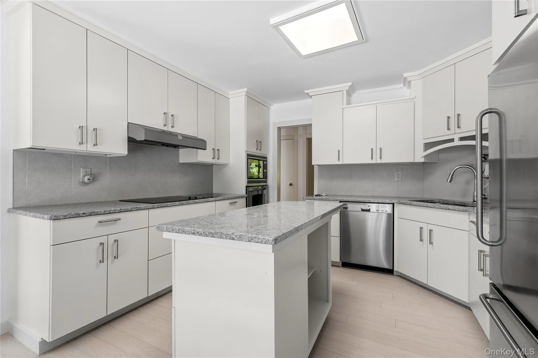 Updated kitchen with center island and granite counters Updated kitchen with center island and granite counters