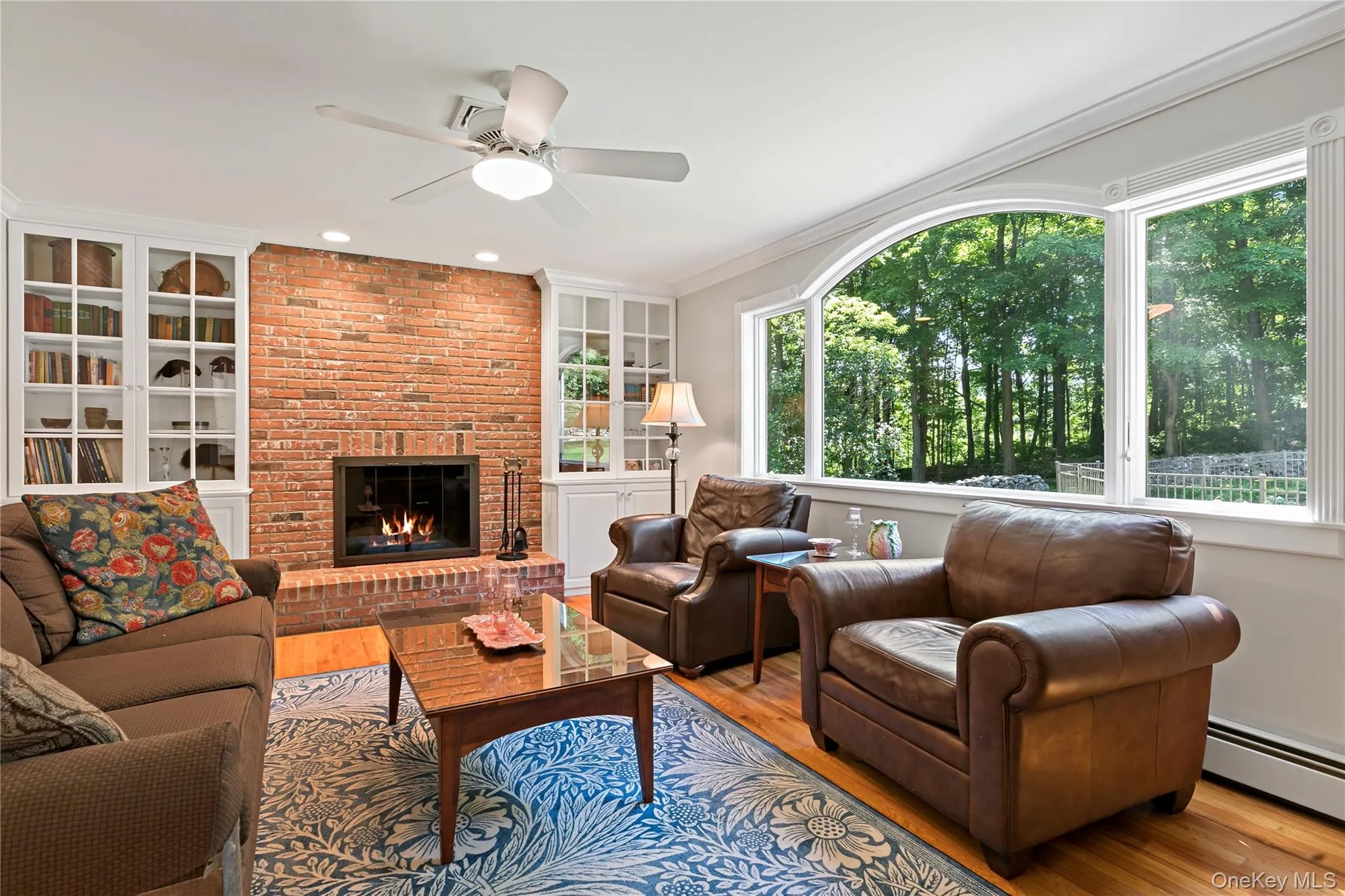 Another view of the living room. Large windows with view of the back yard. Another view of the living room. Large windows with view of the back yard.