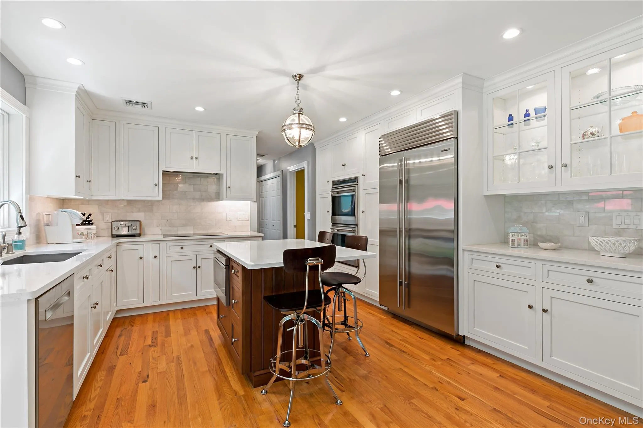 A true pleasure to cook in this kitchen featuring Wolf cooktop and double convection ovens, Bosch dishwasher and SubZero refrigerator. A true pleasure to cook in this kitchen featuring Wolf cooktop and double convection ovens, Bosch dishwasher and SubZero refrigerator.